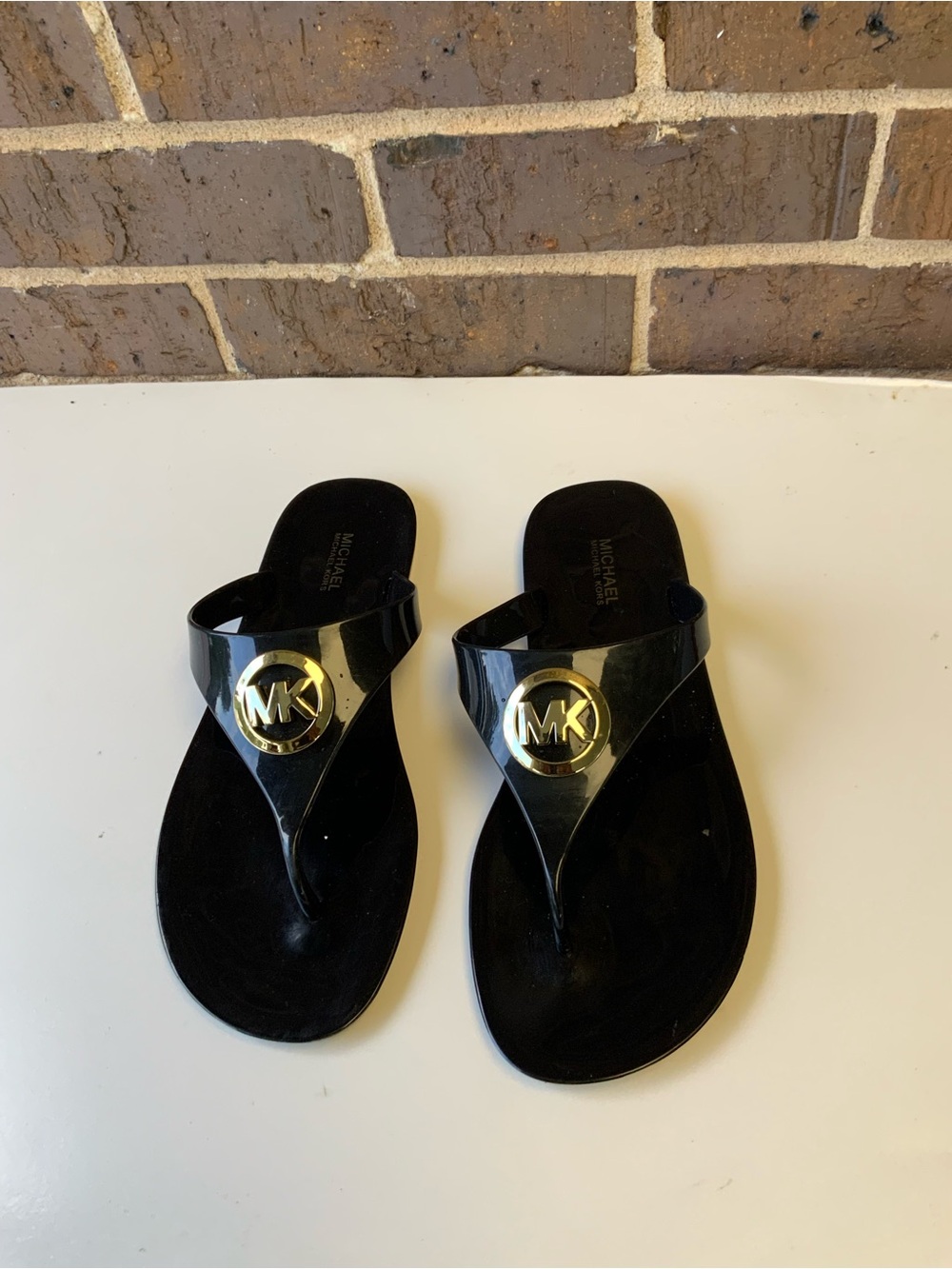 Michael Kors Black Jelly Thong Sandals with Gold MK Emblem